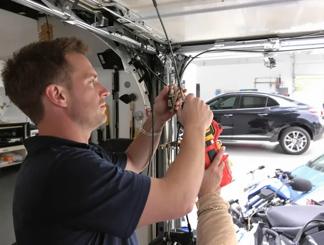 Ridgefield Garage Door Repair safety certified technician performing cable replacement in Ridgefield